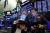 FILE PHOTO: Traders work on the floor of the New York Stock Exchange (NYSE) in New York City, U.S., March 21, 2022.  REUTERS/Brendan McDermid/File Photo