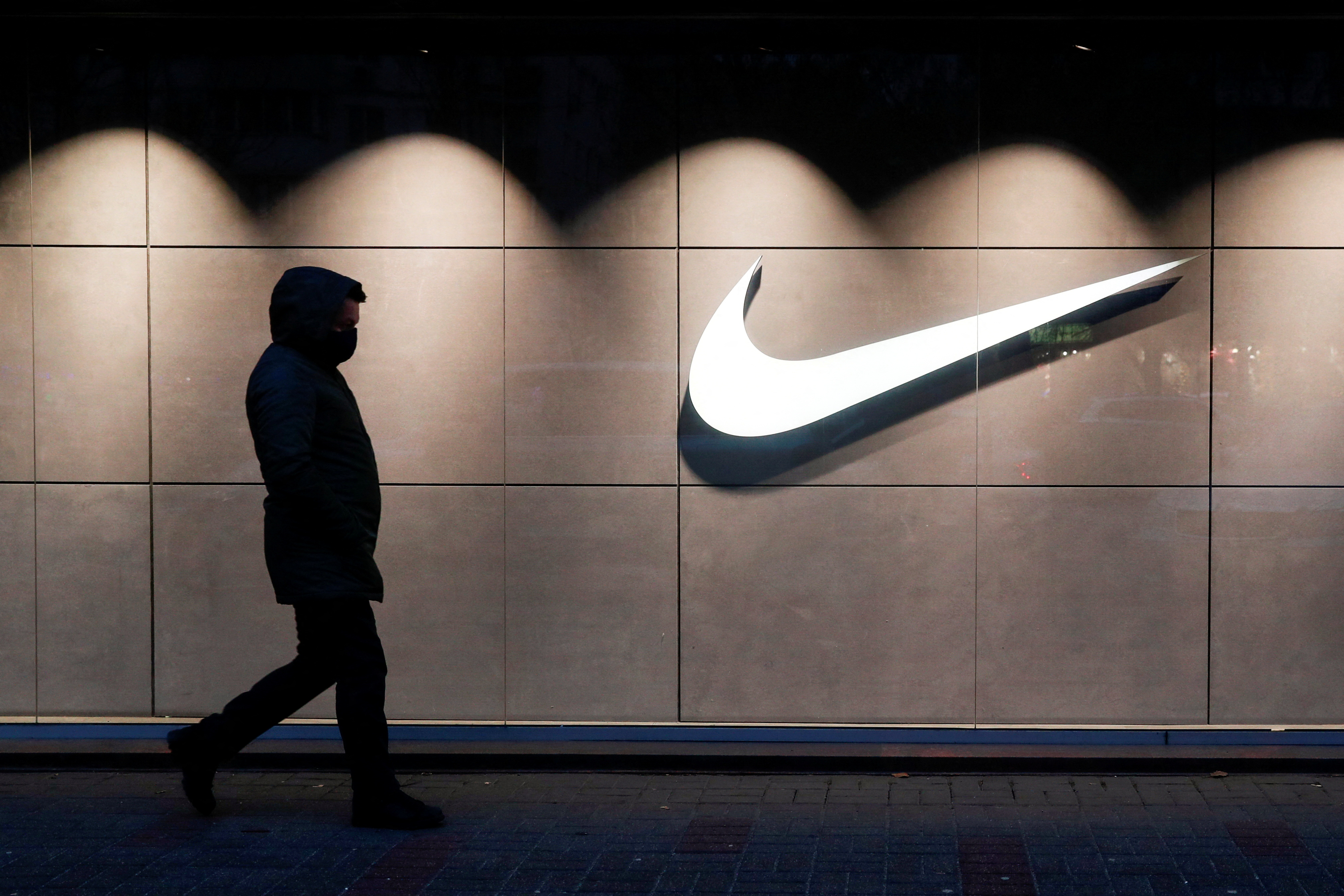Nike stock tumbles 12% on lowered revenue outlook; Anayst cuts rating